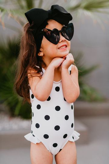 PINK DESERT GIRLS MINI RUFFLE LEG SCOOP ONE PIECE SWIMSUIT IN POLKA DOT